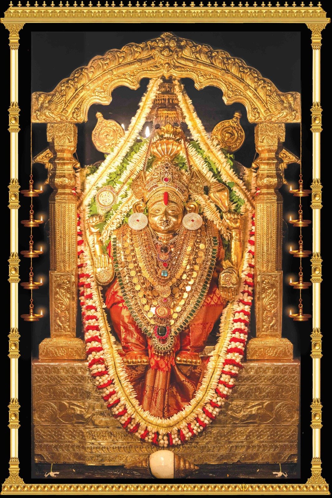 Sri Durga Parameshwari, the presiding deity of Kateel Temple, adorned in gold ornaments and garlands
